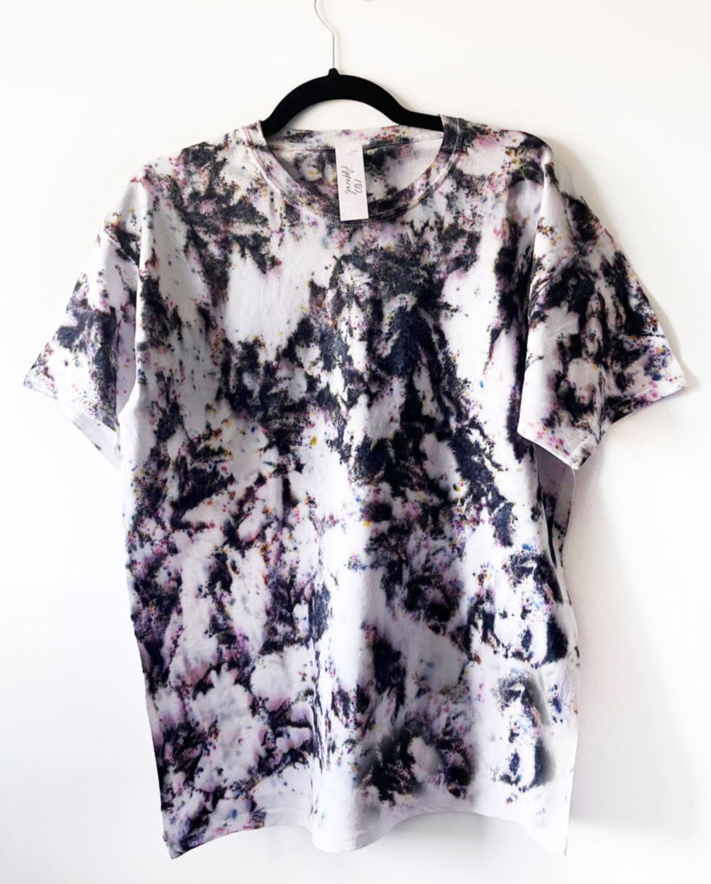 white crewneck t shirt with sprinkled dye to imitate confetti