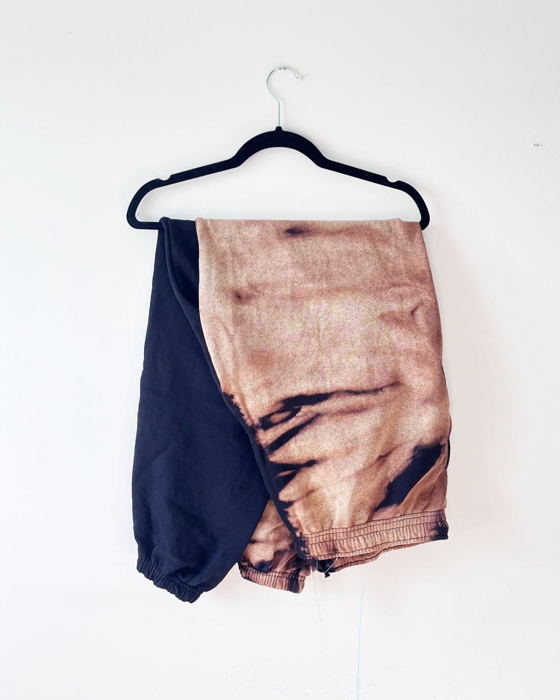 alternative angle shot of two tone sweatpants bleach tie dye joggers