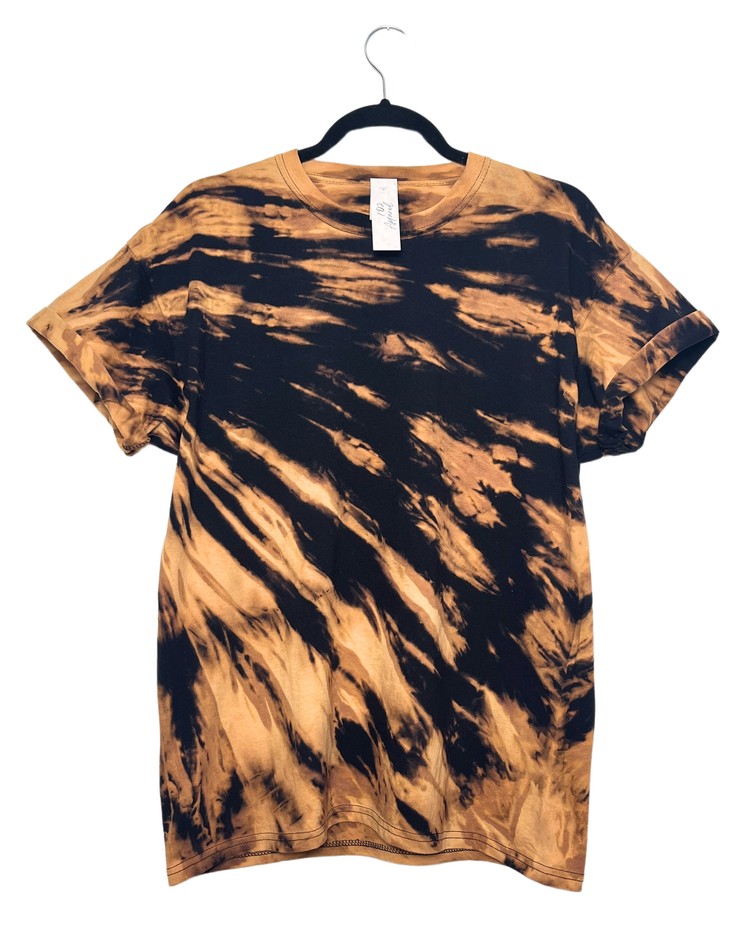 a black crewneck short sleeve t shirt bleached to create orange tiger stripe effect