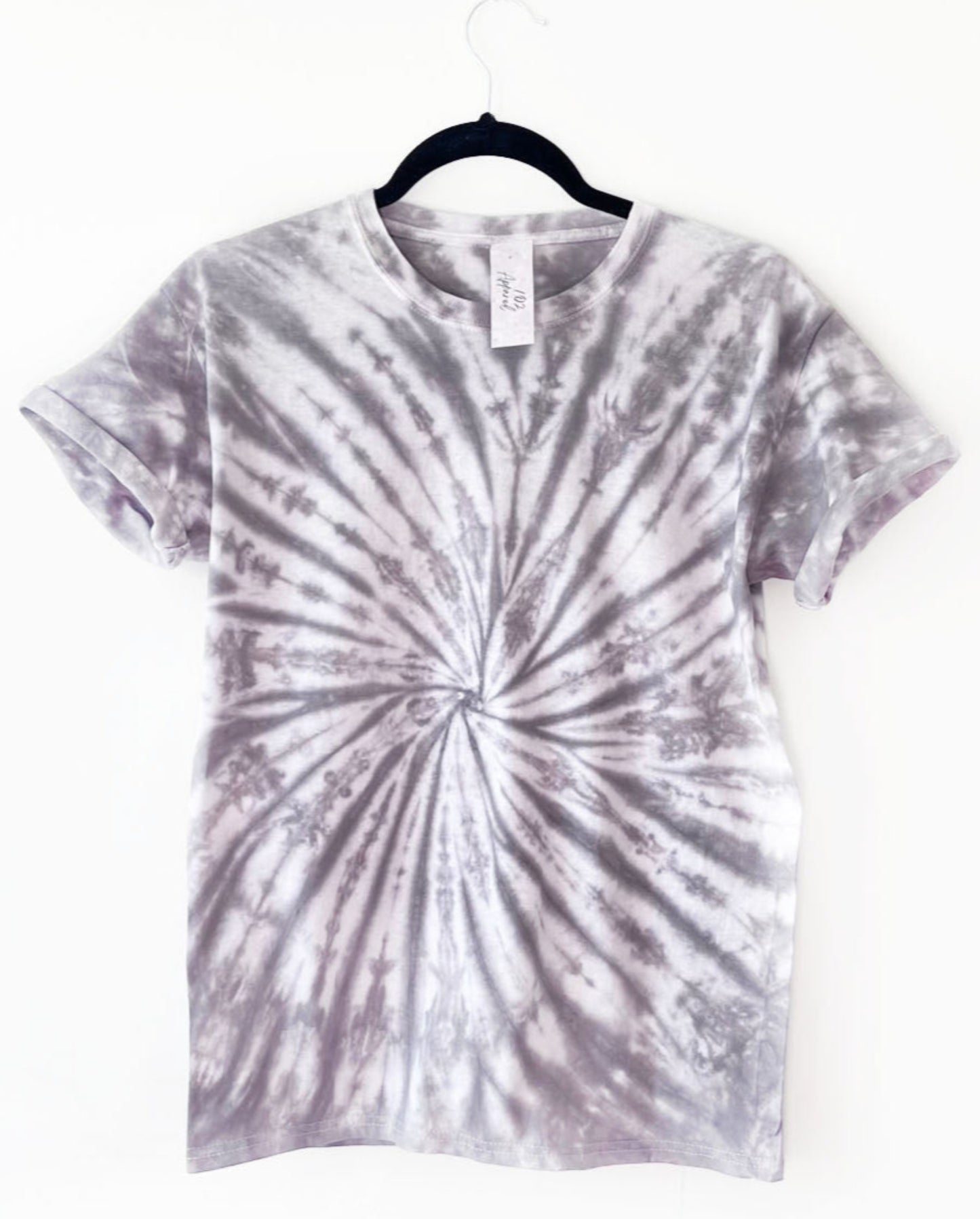 a crewneck t shirt with a fossil like spiral design in grey