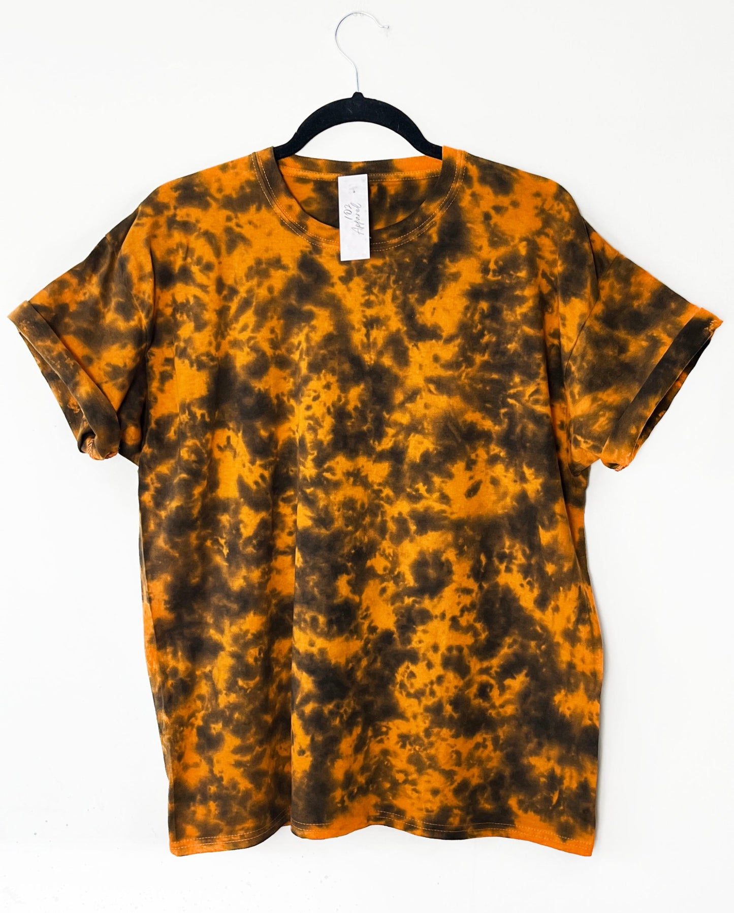 an orange crewneck t shirt with black pattern