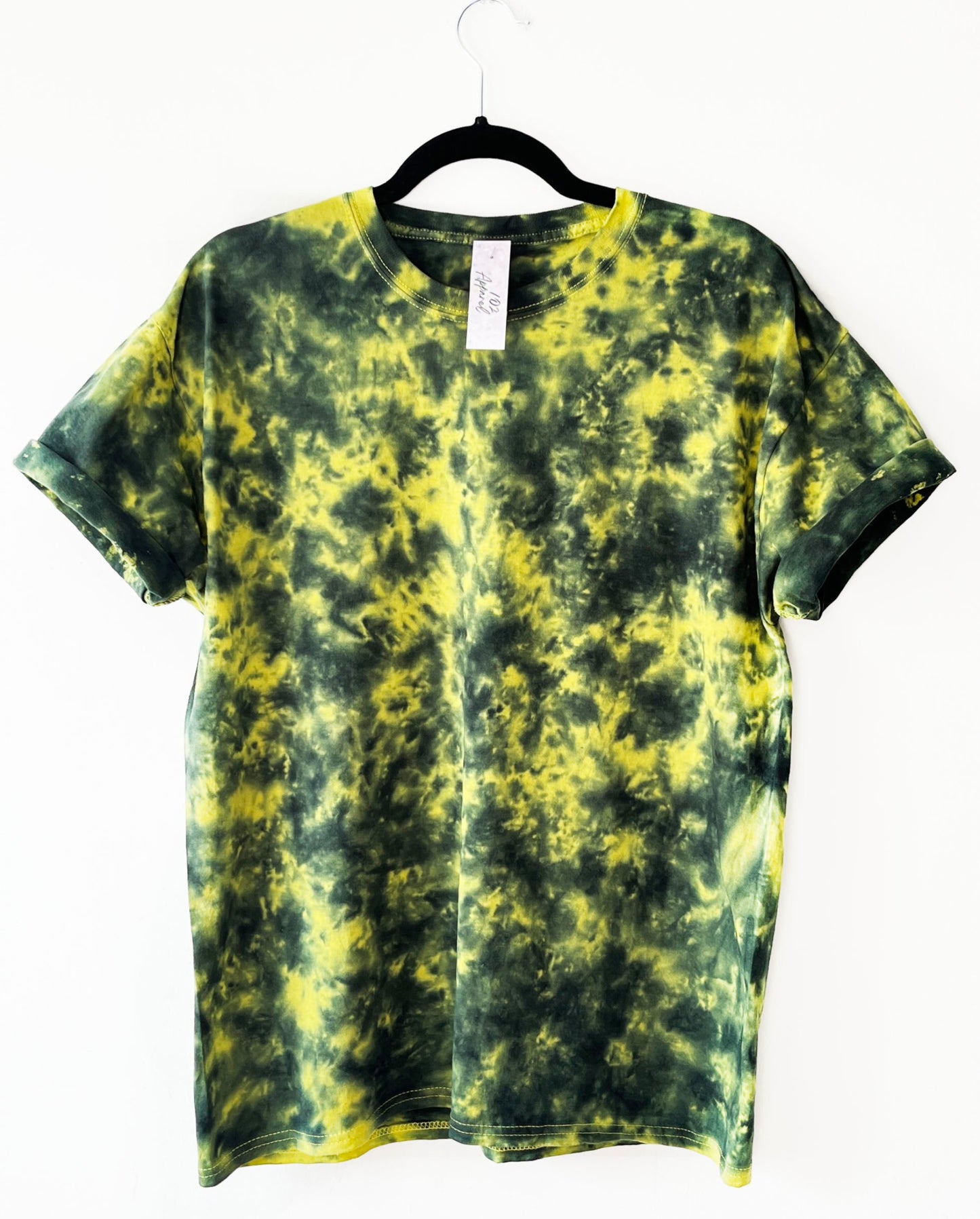 a yellow crewneck t shirt with black pattern
