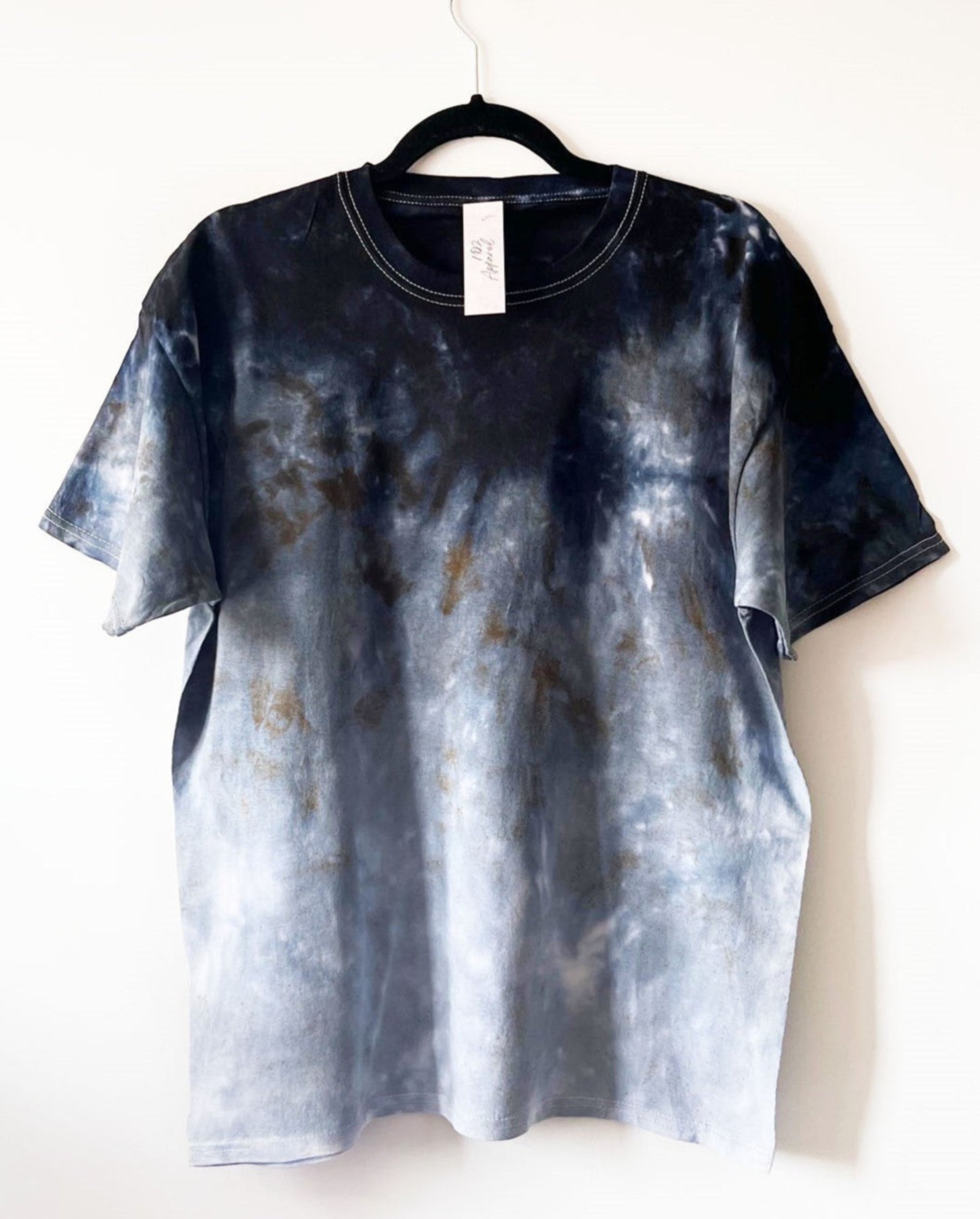 short sleeve crewneck t shirt with a black ombre design, starting with dark black at the shoulders, gradient to light grey down to the hem