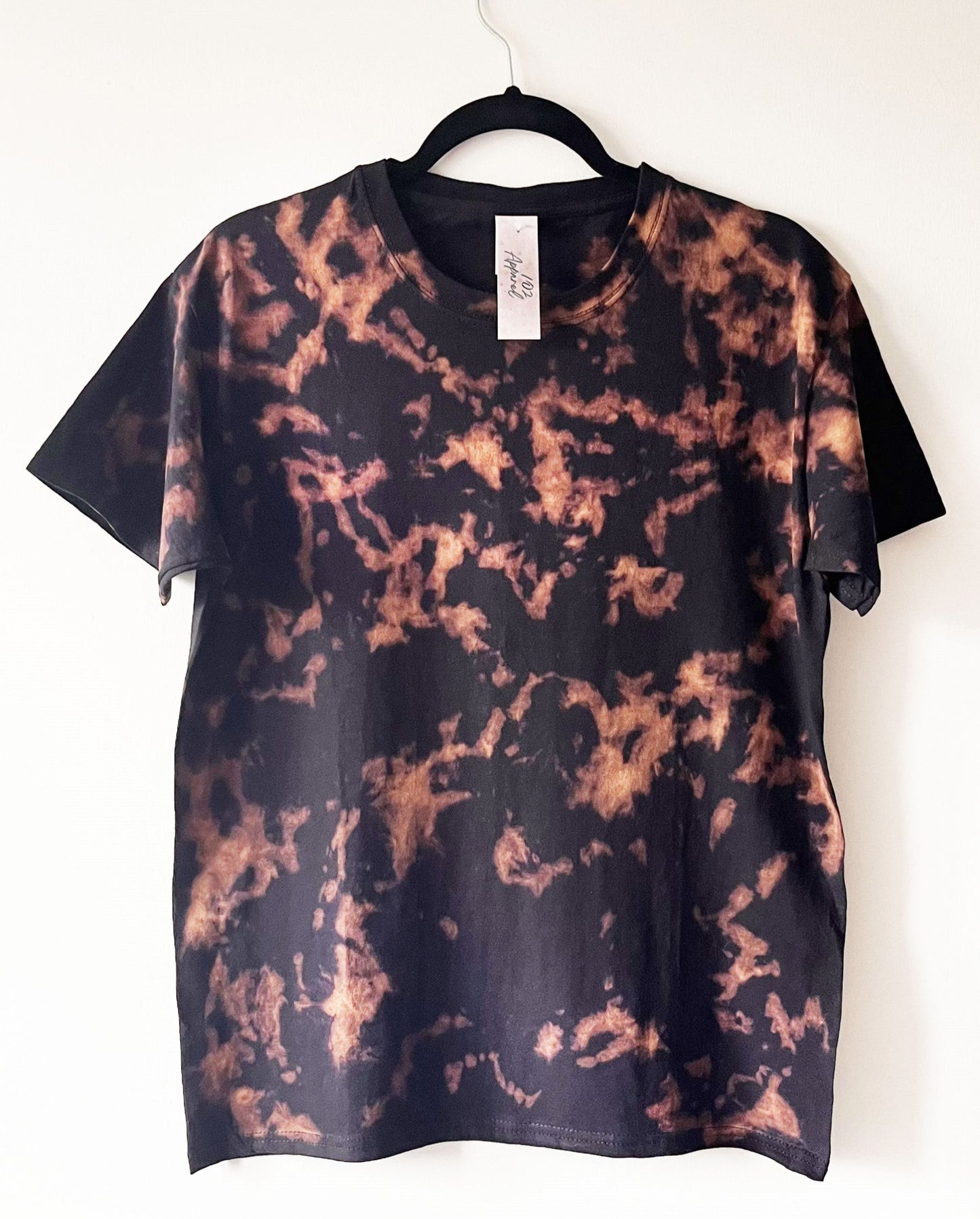 black short sleeve crewneck t shirt with orange / copper crunch tie dye pattern