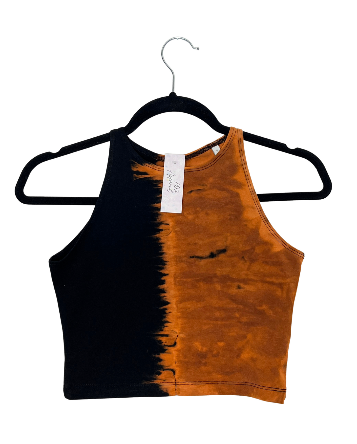 a racerback crop top with one side black and the other side bleach tie dye orange