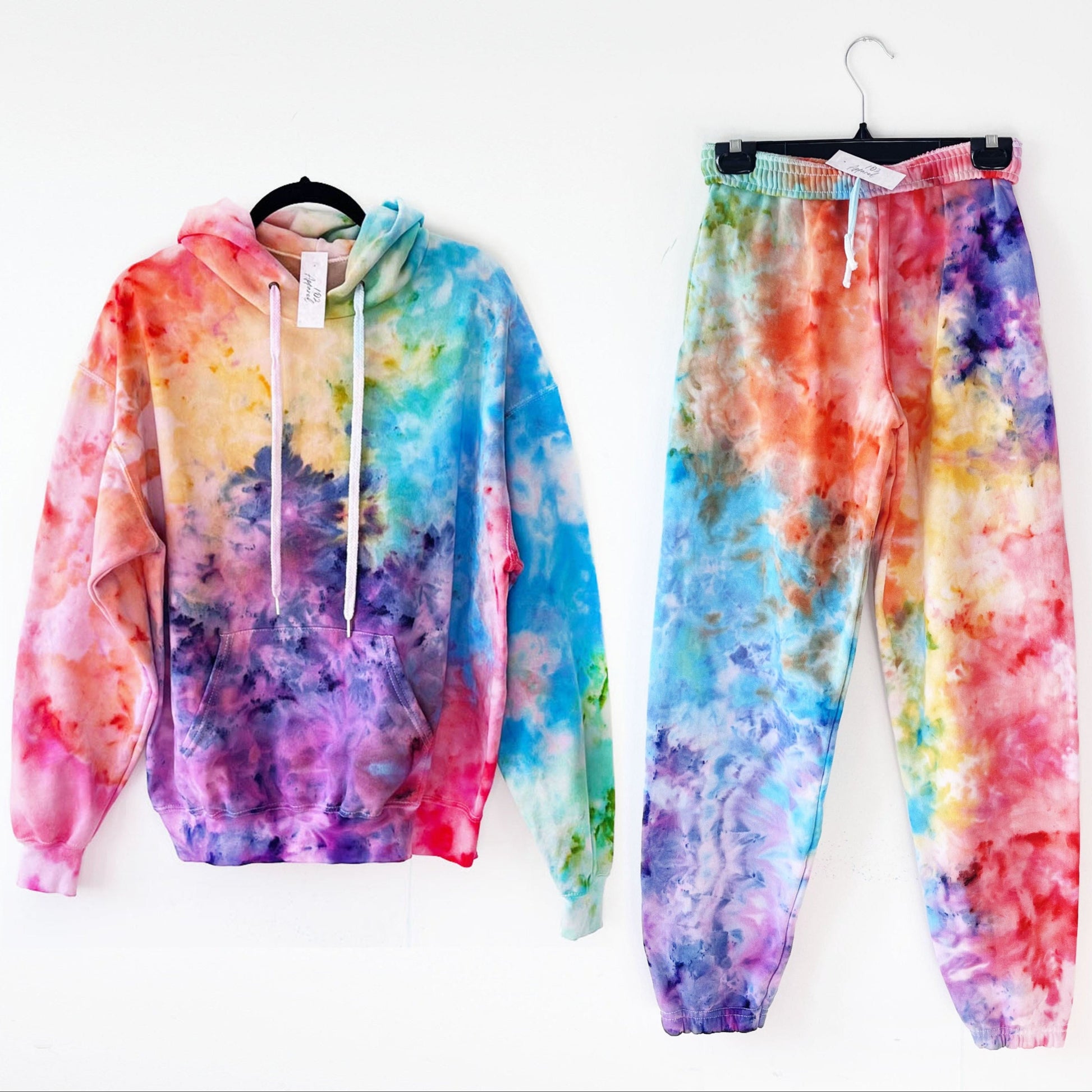 A rainbow hoodie with blended scrunch effect in multiple bright colours, matching sweatpants
