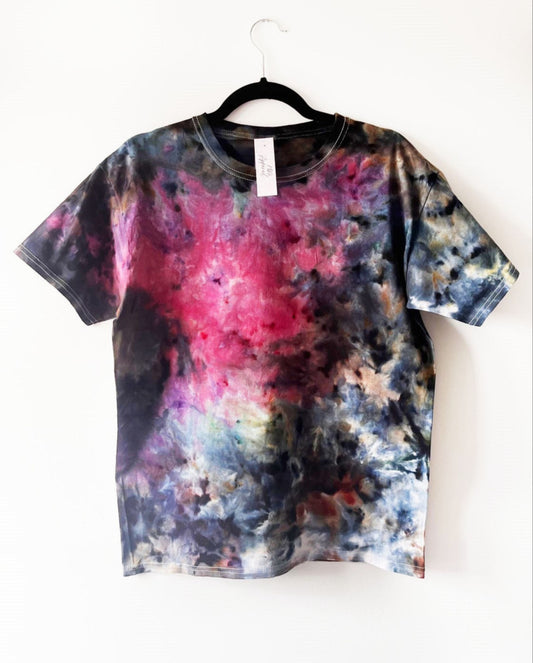 short sleeve crewneck t shirt with ice tie dye print, mostly dark colours at the edges with a print designed to look like the carina nebula, red in the middle with various colours around the outside