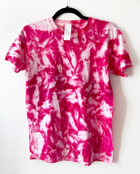 a crewneck t shirt with bright pink swirly pattern