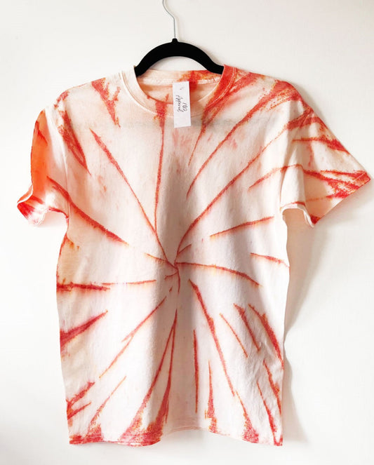 white crewneck t shirt with spiral design in orange, orange speckled swirl