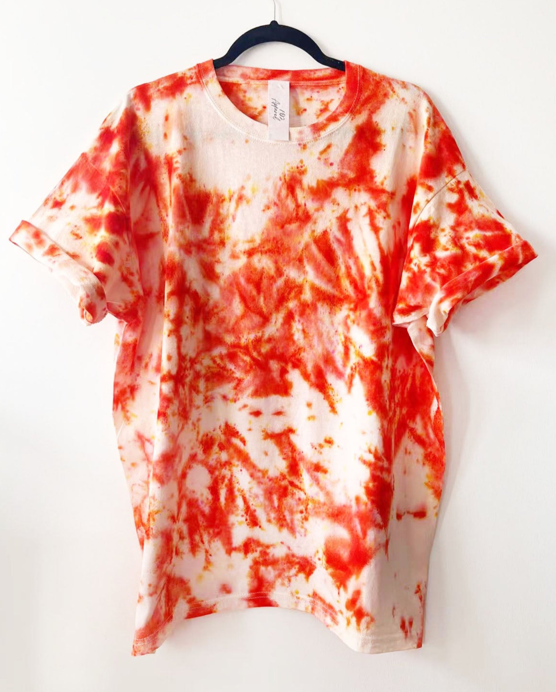 white crewneck t shirt with orange 