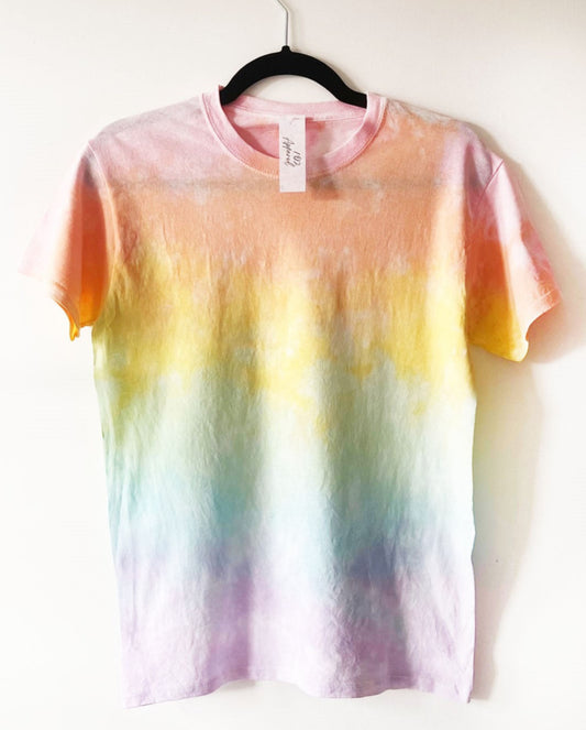 a crewneck t shirt with pastel rainbow colours in rectangle sections, starting with pink and blending down to purple at the bottom