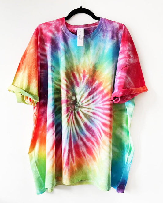 a crewneck t shirt with a multicolour rainbow spiral tie dye design 